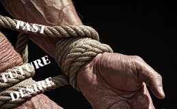 The Ropes That Bind Us: Past, Future, and Desire An evocative image depicting a muscular arm tightly bound by a thick rope. The strands are labeled 'Past,' 'Future,' and 'Desire' to symbolize the mental burdens of regret, anxiety, and attachment that are discussed in the Stoic guide to mental freedom.